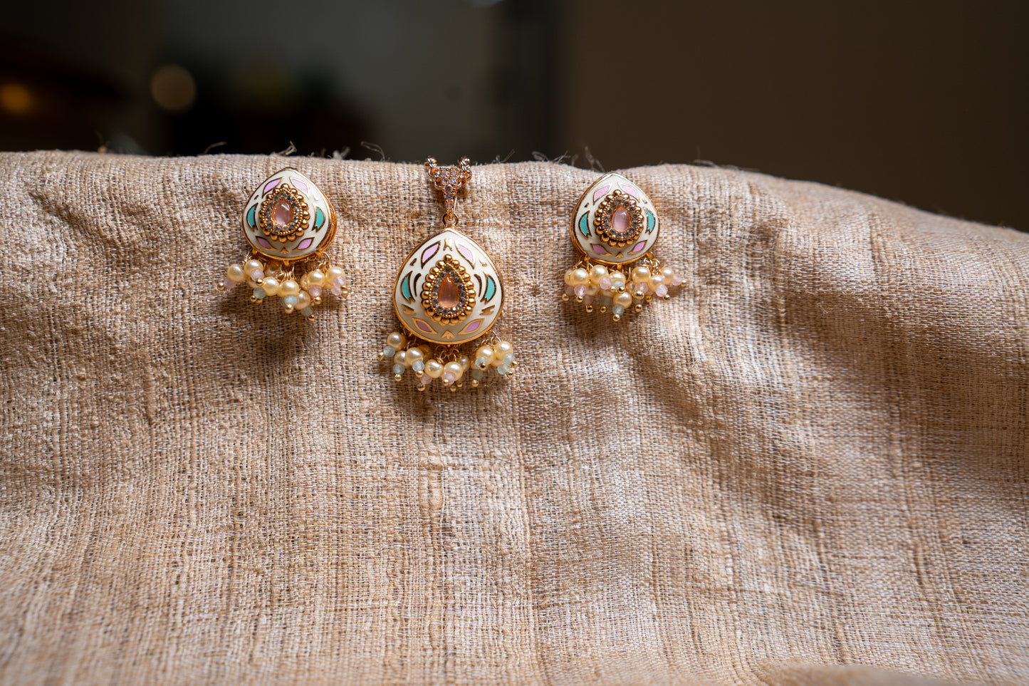 An elegant pendant set with enamel work in beautiful colours