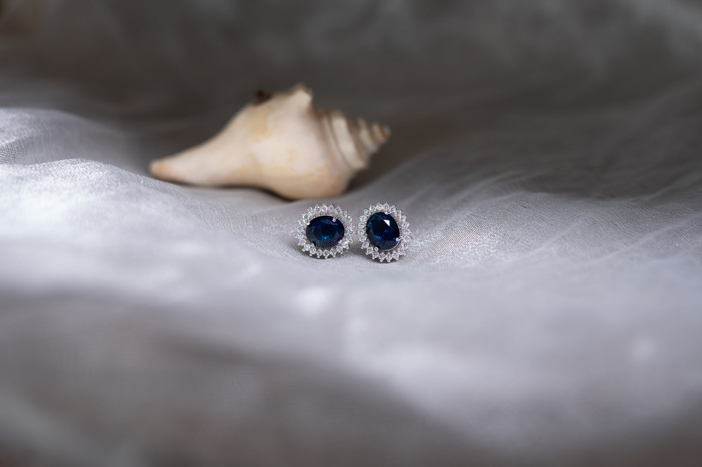 Blue sapphire American diamond earrings in oval shape