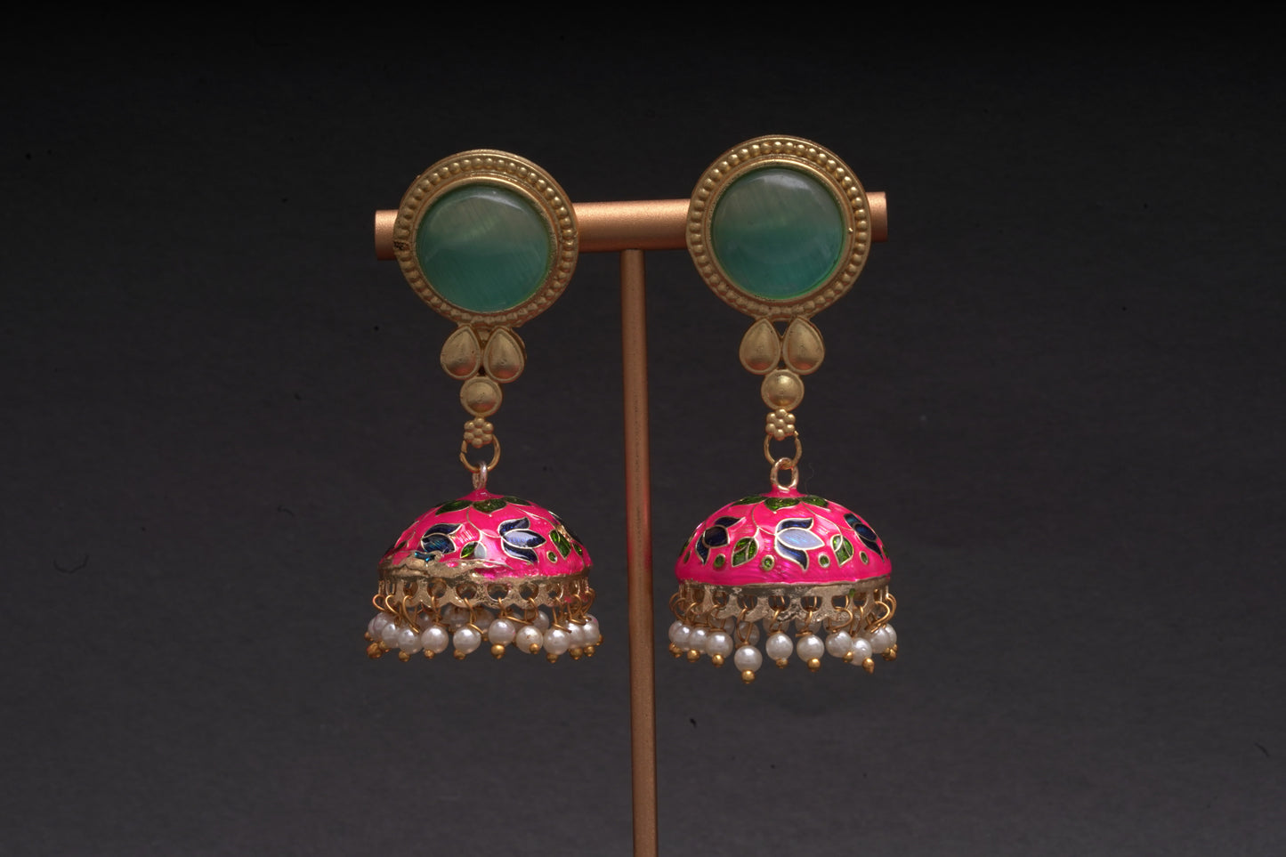 Colourful jhumkas in pink and green with an enamel finish