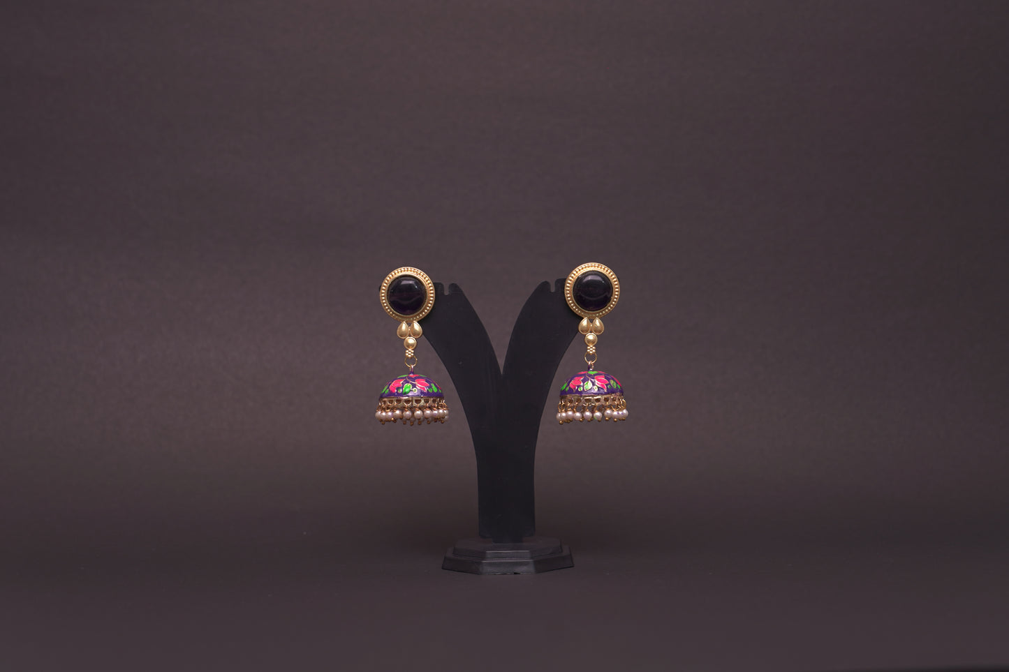 Colourful jhumkas in purple and black with an enamel finish