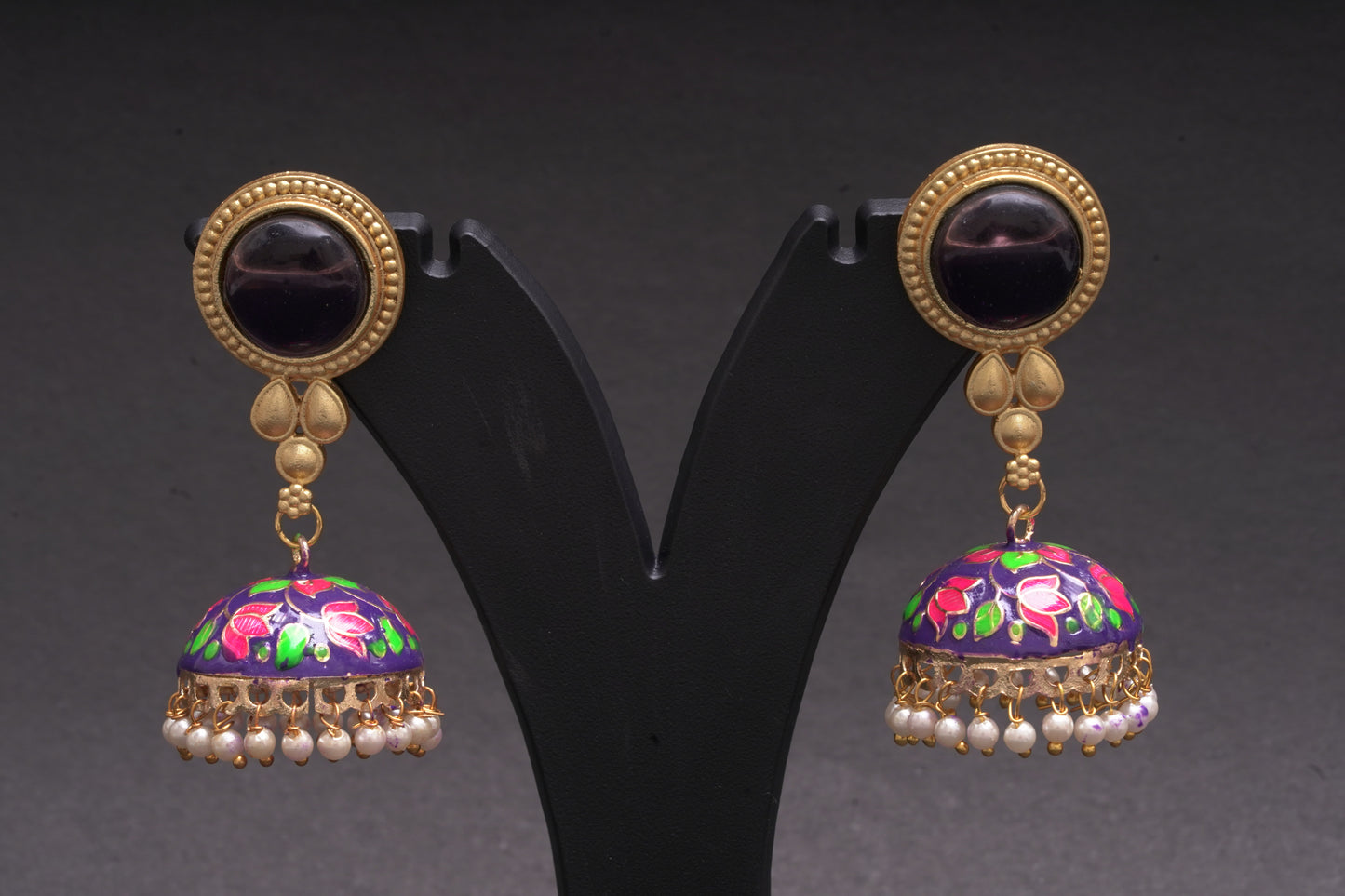 Colourful jhumkas in purple and black with an enamel finish