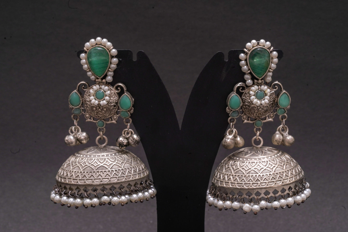 Dazzling Silver-Finish Jhumkas with Light Green Stones