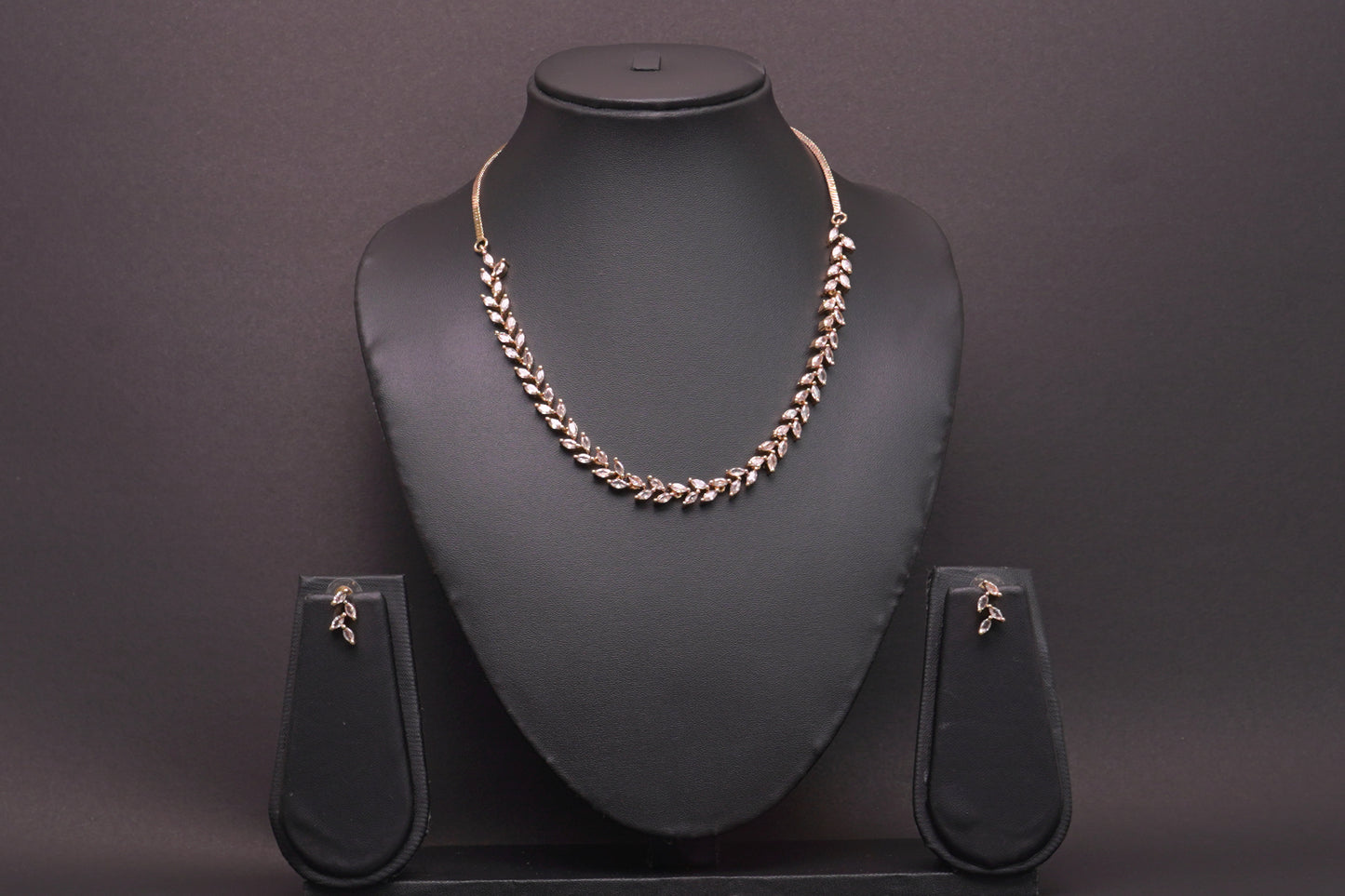 Delicate leaf motif necklace set in real American diamonds with gold finish