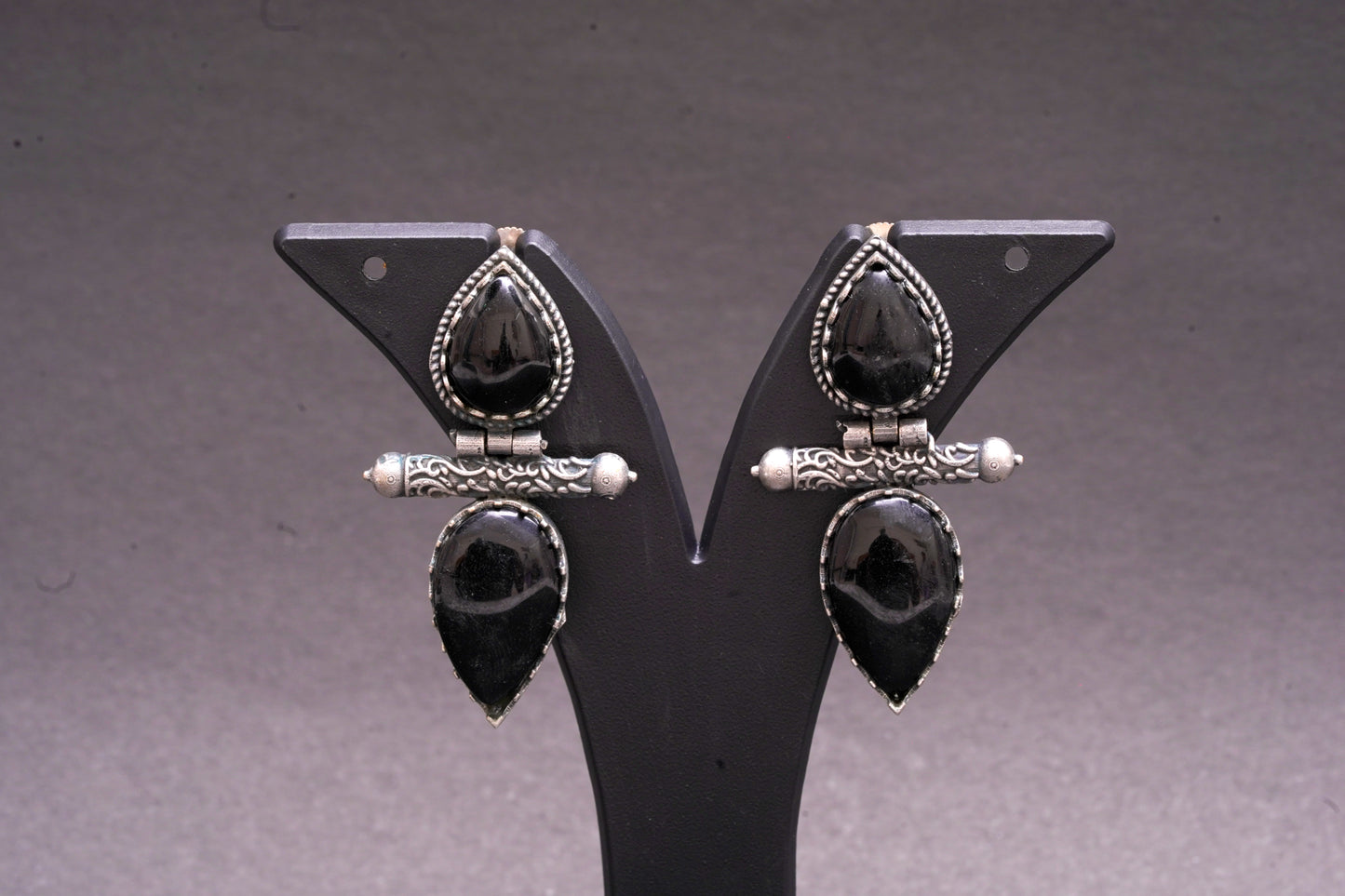 Dual tear drop earrings with black stone in silver finish