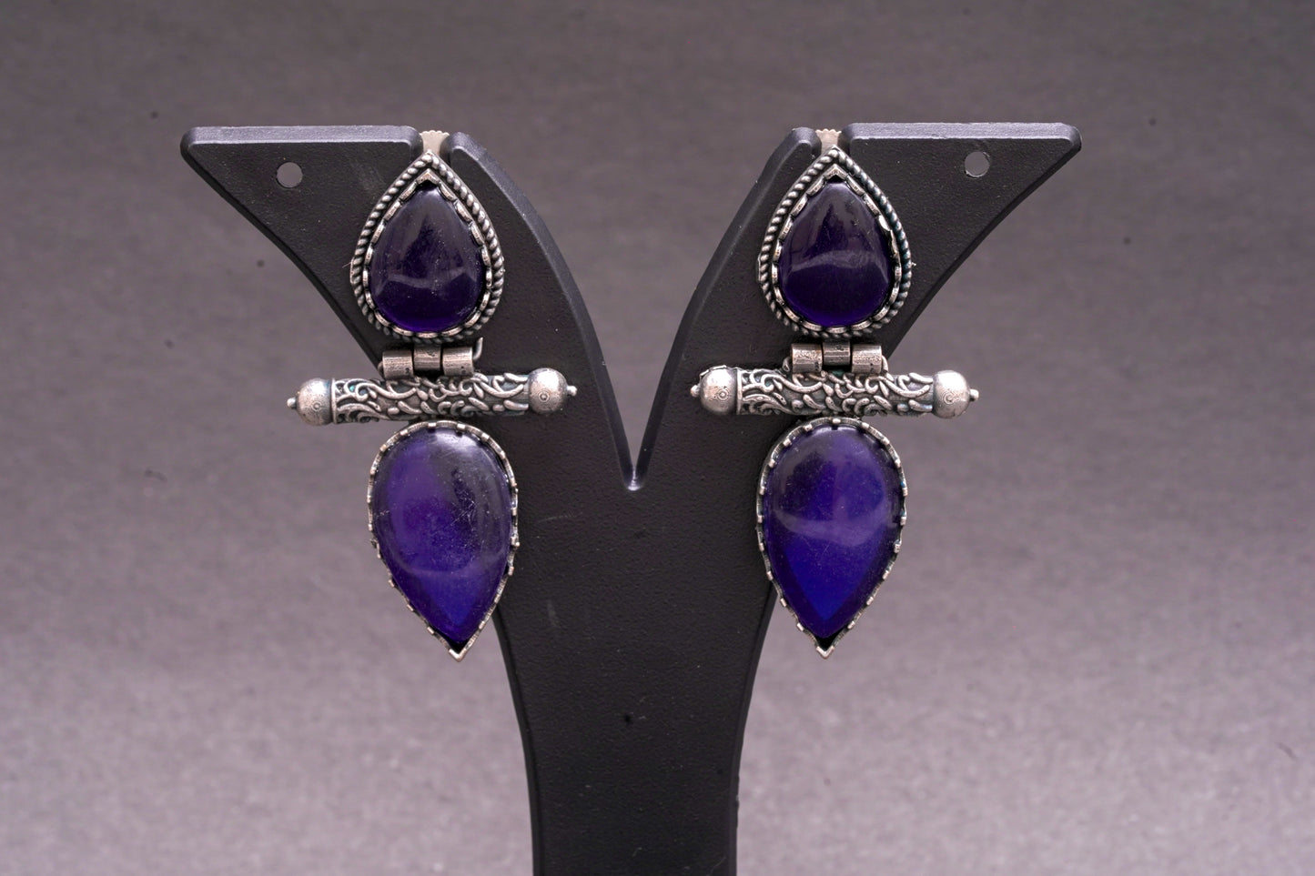 Dual tear drop earrings with blue stone in silver finish