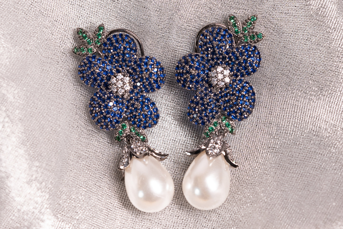 Exquisite flower shaped earrings with a pearl drop