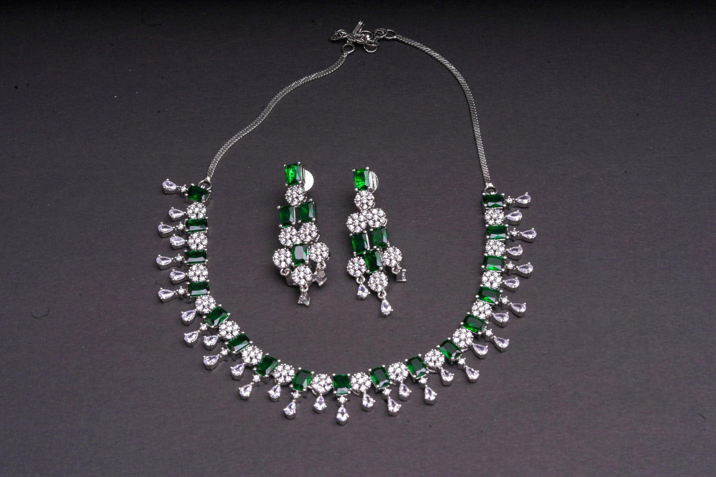 Glittering emerald stone and American diamond necklace with matching earrings