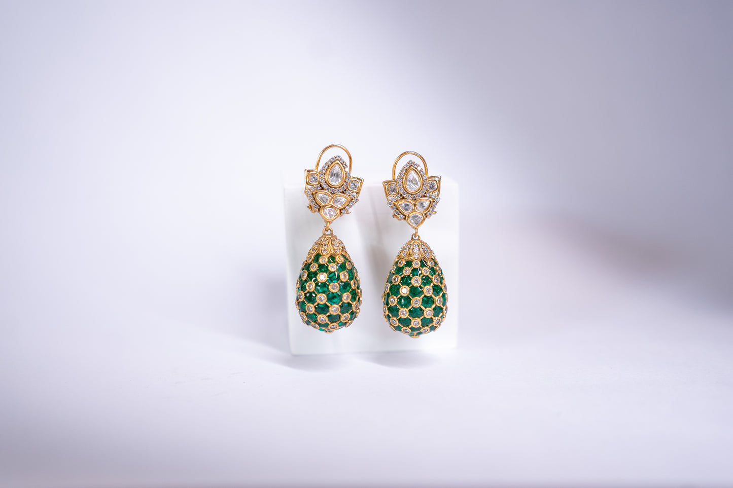 Gold-finish tear drop meenakari earrings in green