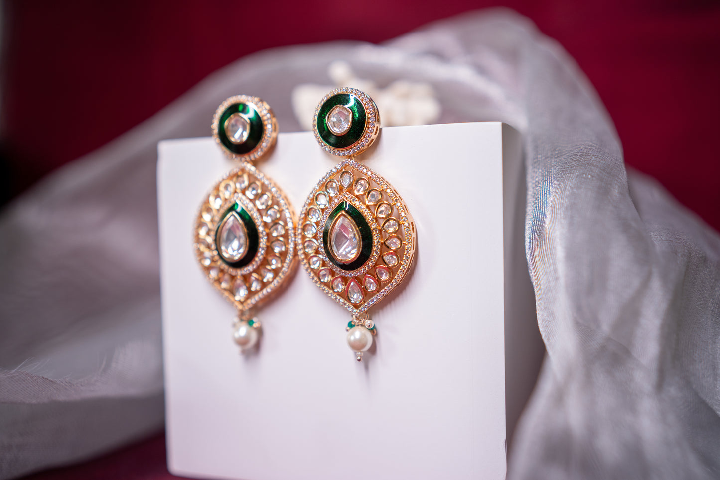 Green and gold danglers in polki stone