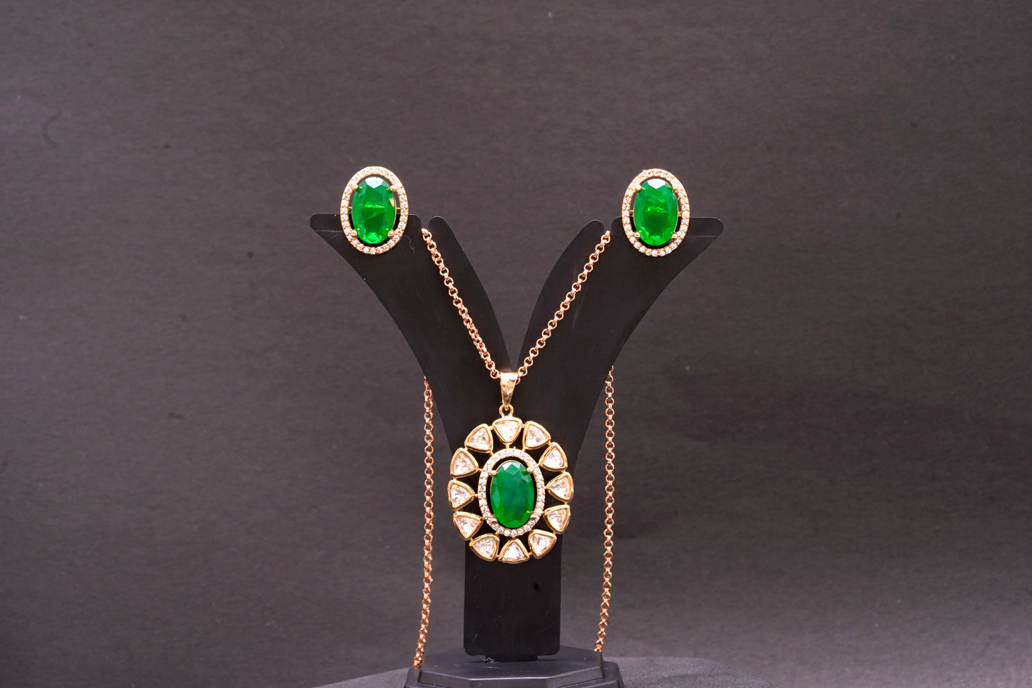 Green emerald stone and polki pendant set in gold finish