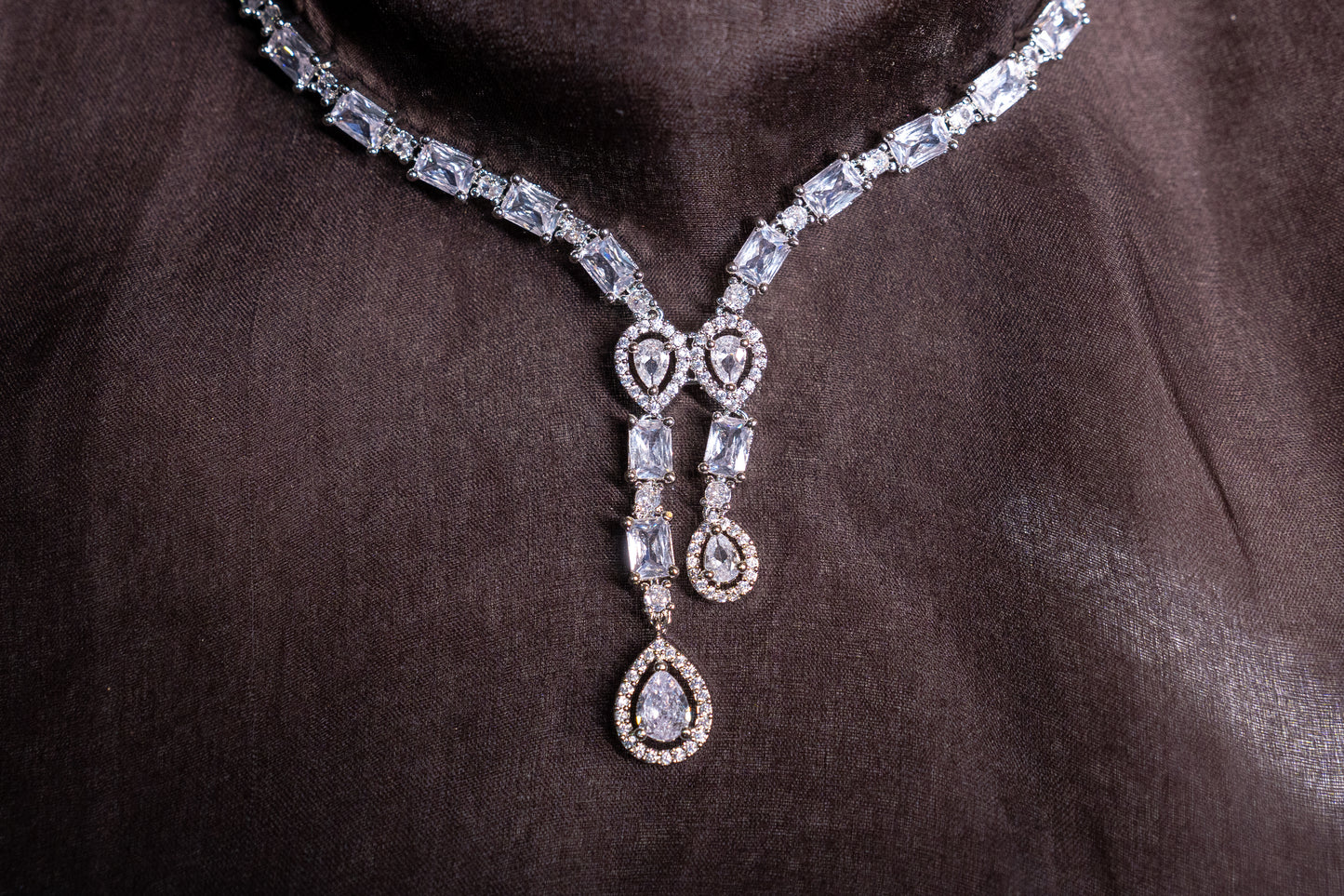 Irresistible necklace set with a double tear drop pendant in real American diamonds