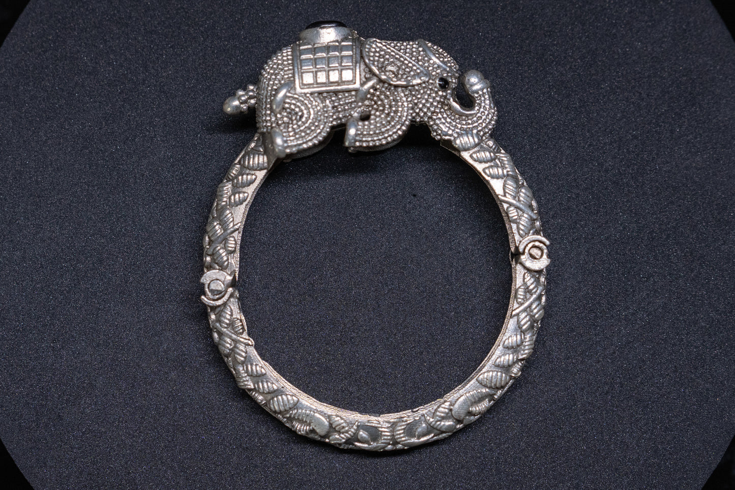 Elephant bracelet with opulent carving in silver finish