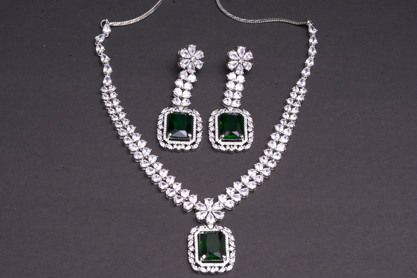 Statement American diamond double layer necklace with green emerald stone pendant