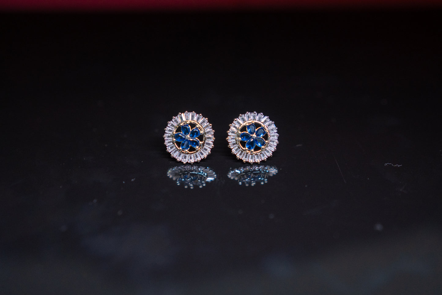 Alluring ear studs with blue sapphire stone and real American diamonds