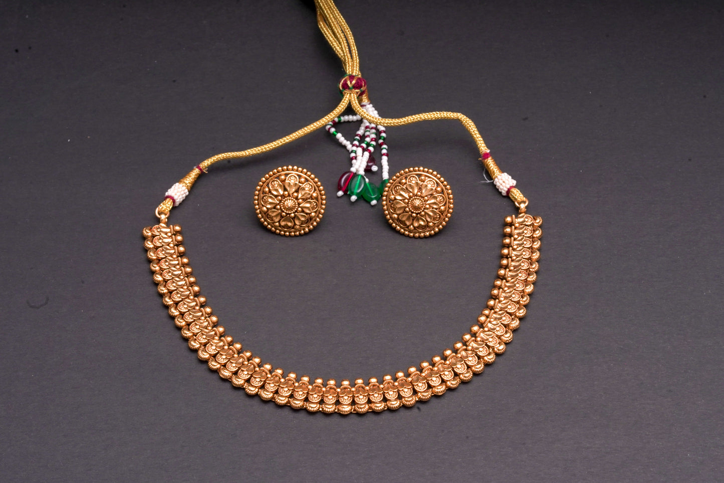 Antique gold finish necklace with earrings in an intricate design