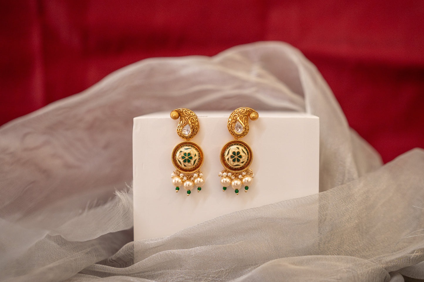 Beautiful gold finish stone polki and enamel work earrings in green
