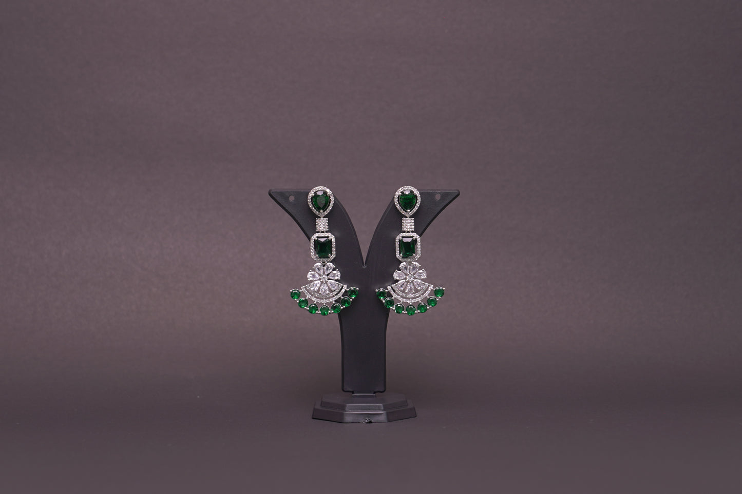 Chandelier earrings in real American diamonds and emerald green stones in a glittering finish