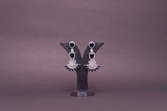 Chandelier earrings in real American diamonds and sapphire blue stones in a glittering finish