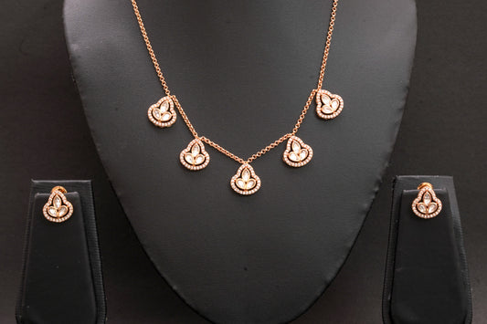 Clover shape pendant set with polki stone and American diamonds in a gold finish