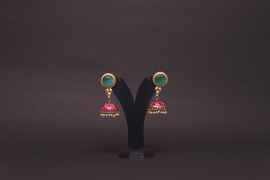 Colourful jhumkas in pink and green with an enamel finish