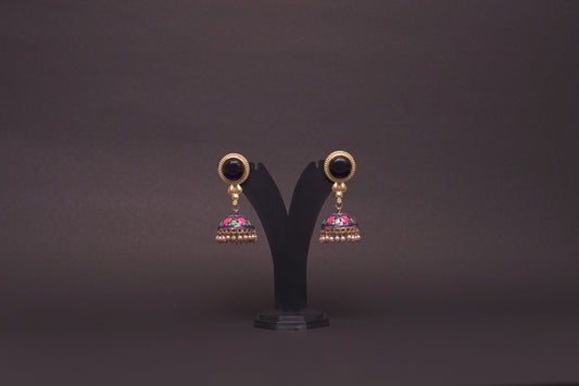 Colourful jhumkas in purple and black with an enamel finish