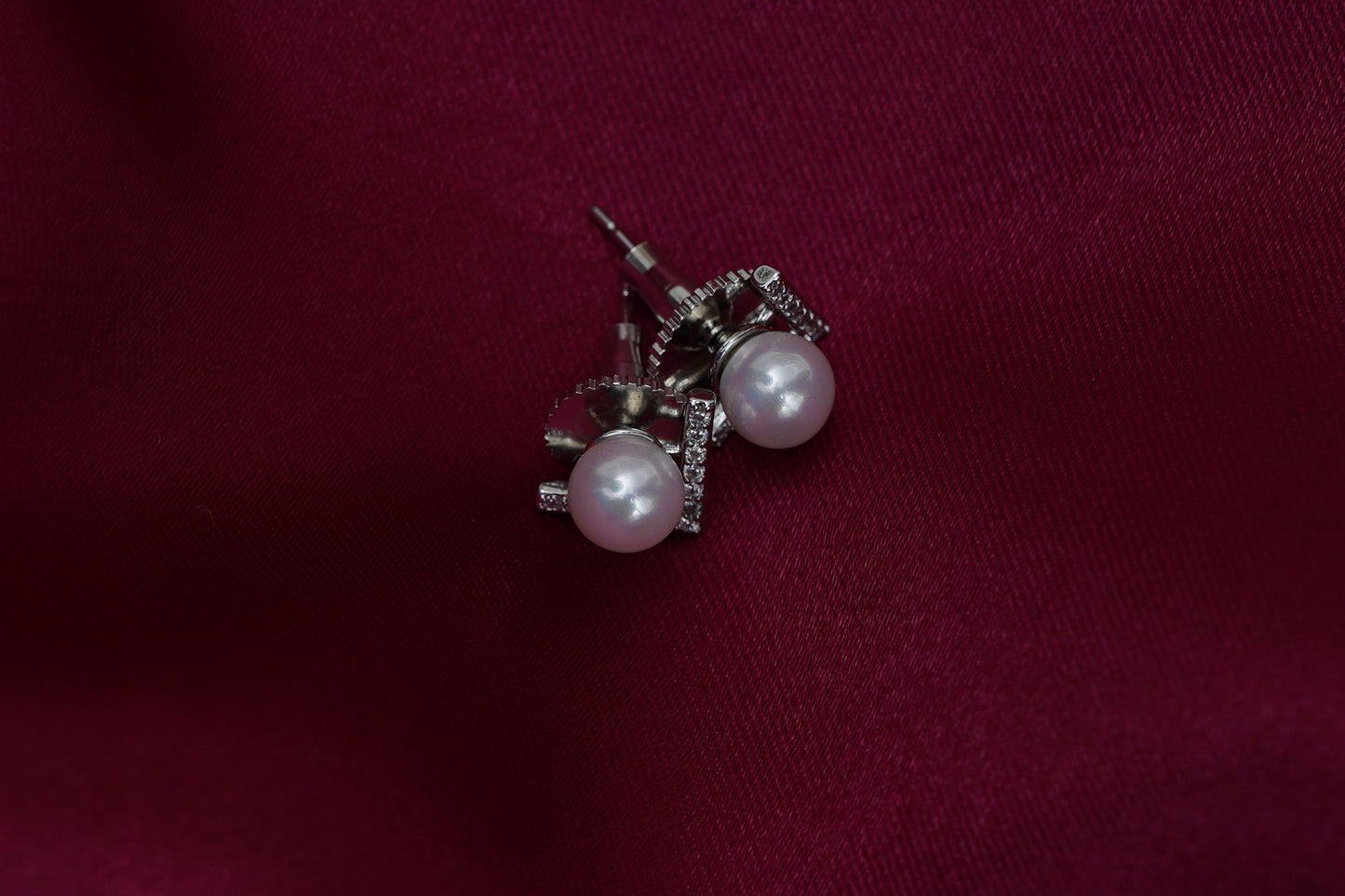 Cupid pearl ear studs in silver finish