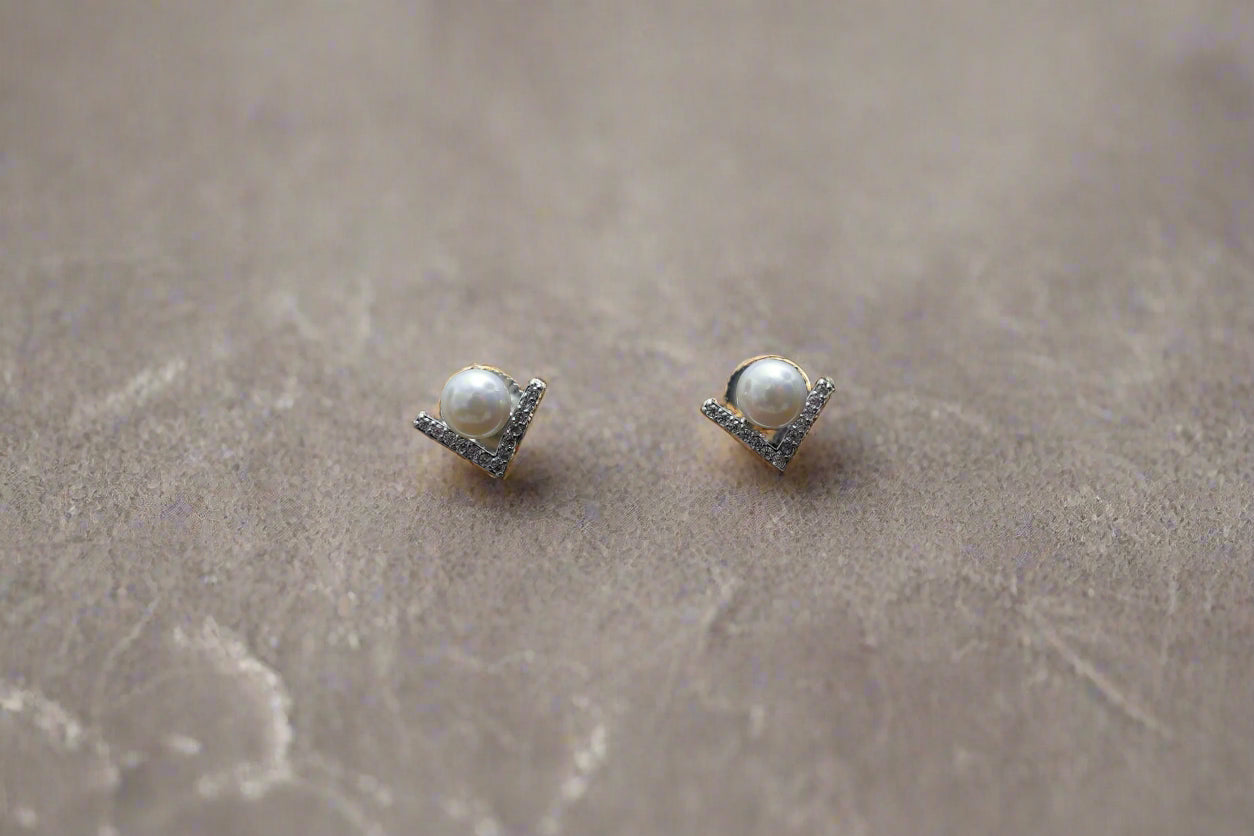 Cupid pearl ear studs in silver finish