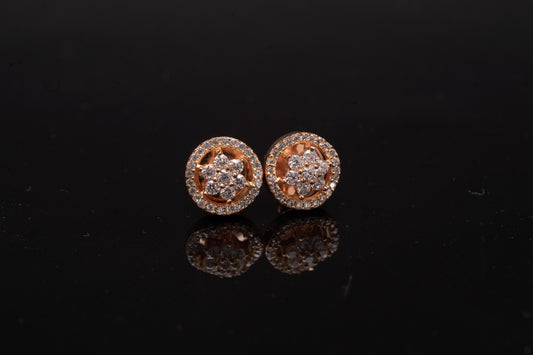 Delicate flower shaped American diamond ear studs in gold finish