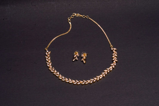 Delicate leaf motif necklace set in real American diamonds with gold finish
