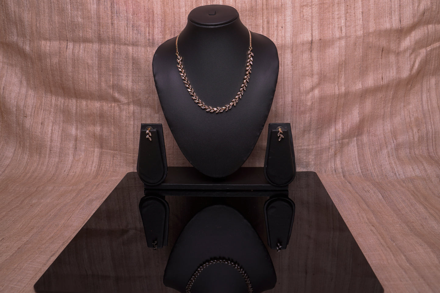 Delicate leaf motif necklace set in real American diamonds with gold finish