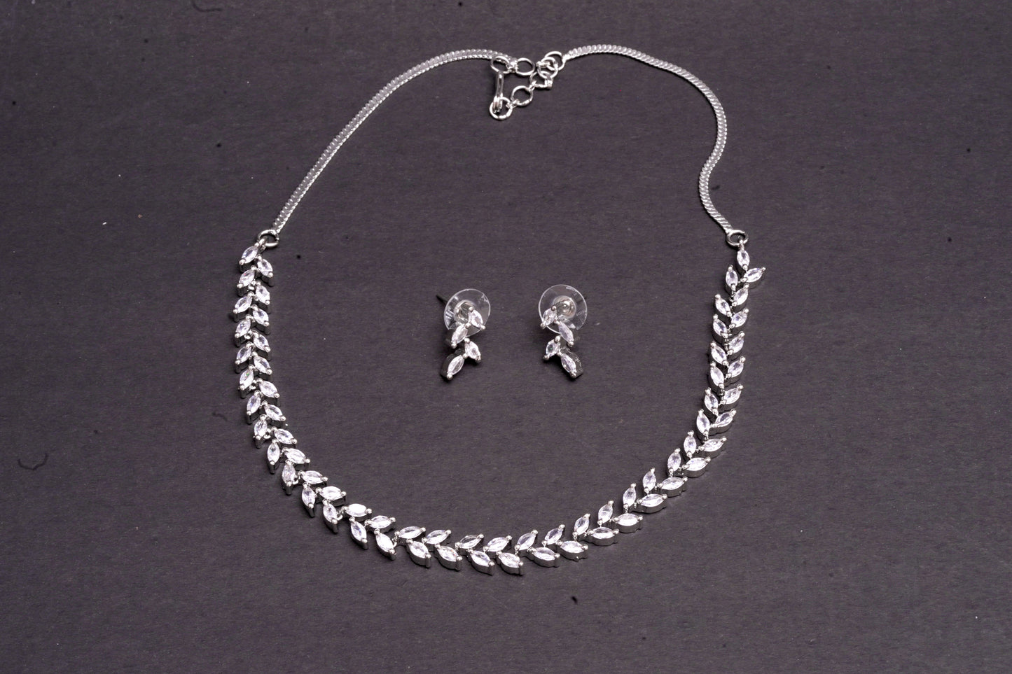 Delicate leaf motif necklace set in real American diamonds with platinum finish