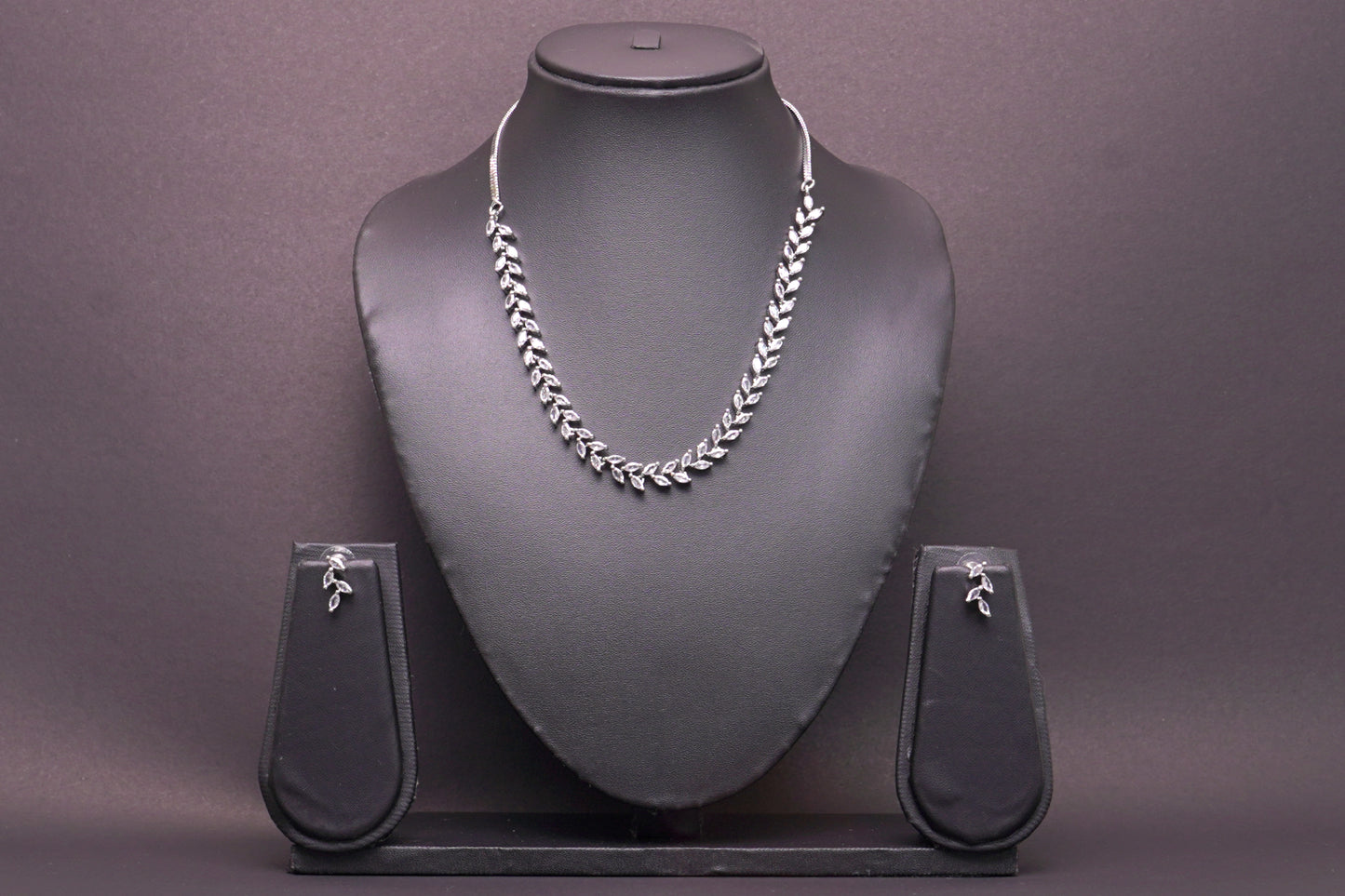 Delicate leaf motif necklace set in real American diamonds with platinum finish