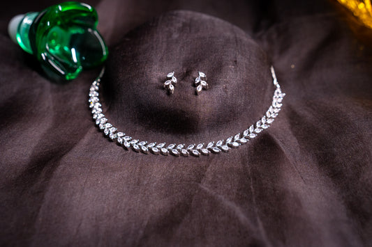 Delicate leaf motif necklace set in real American diamonds with platinum finish