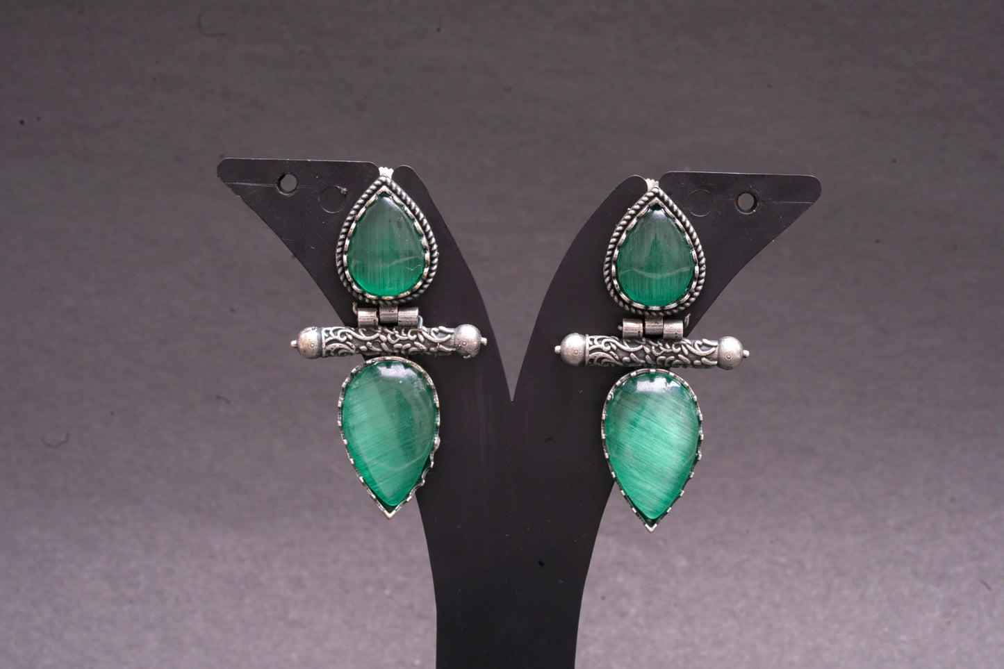 Dual tear drop earrings with sea green stone in silver finish
