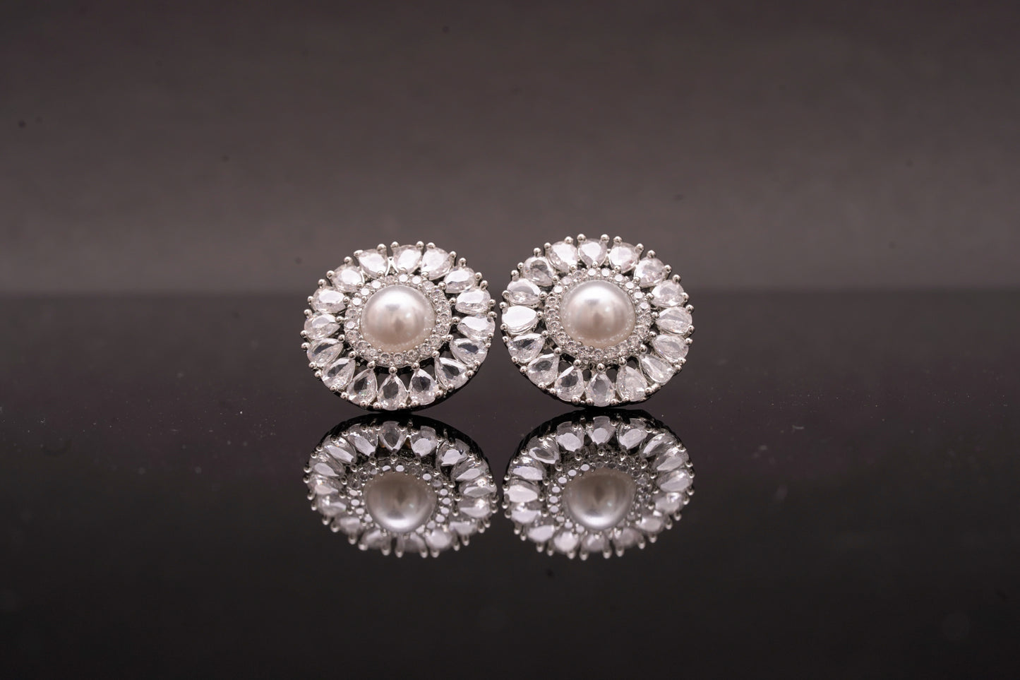 Effortlessly beautiful round ear studs with pearl and real American diamonds