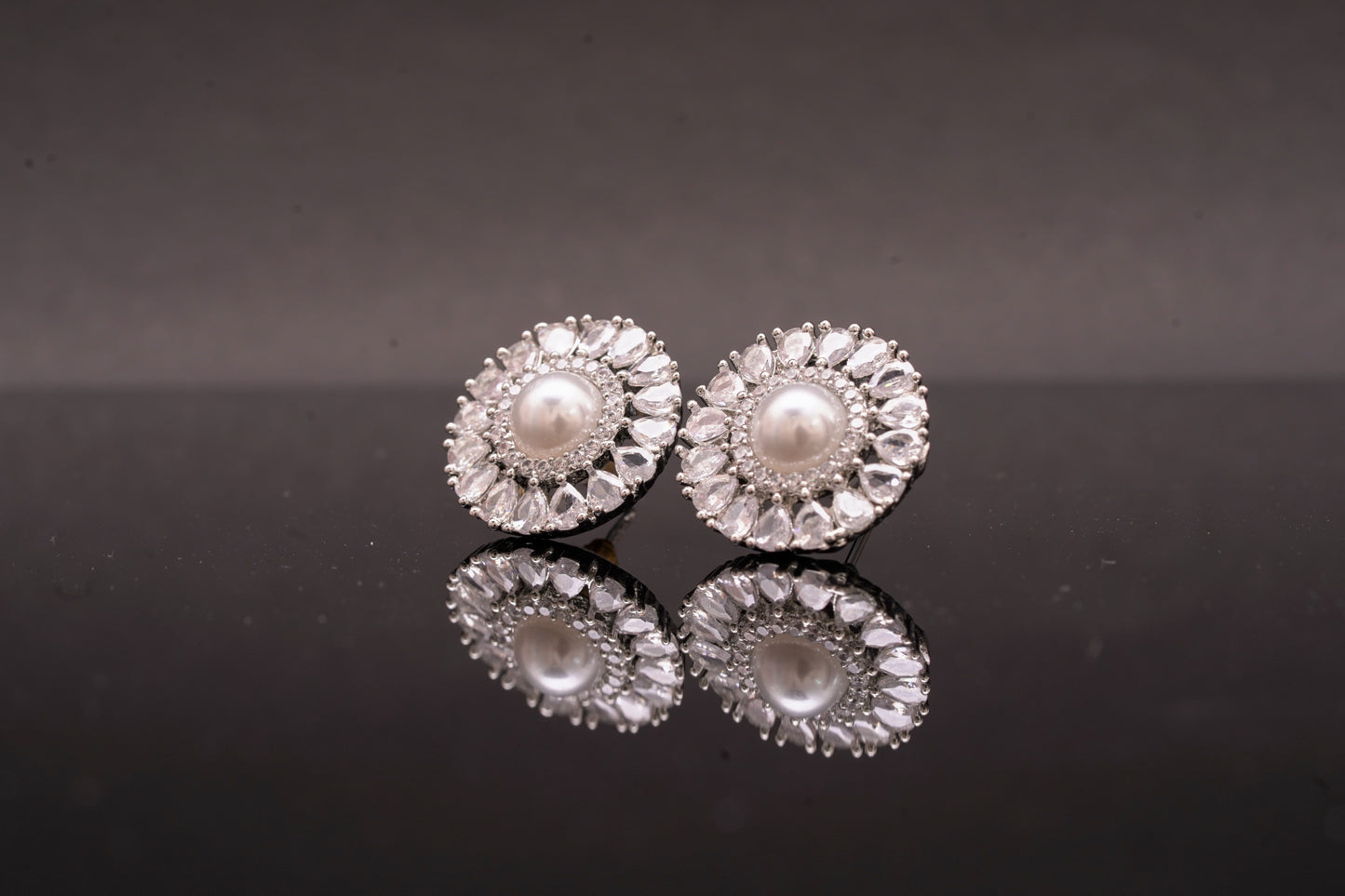 Effortlessly beautiful round ear studs with pearl and real American diamonds