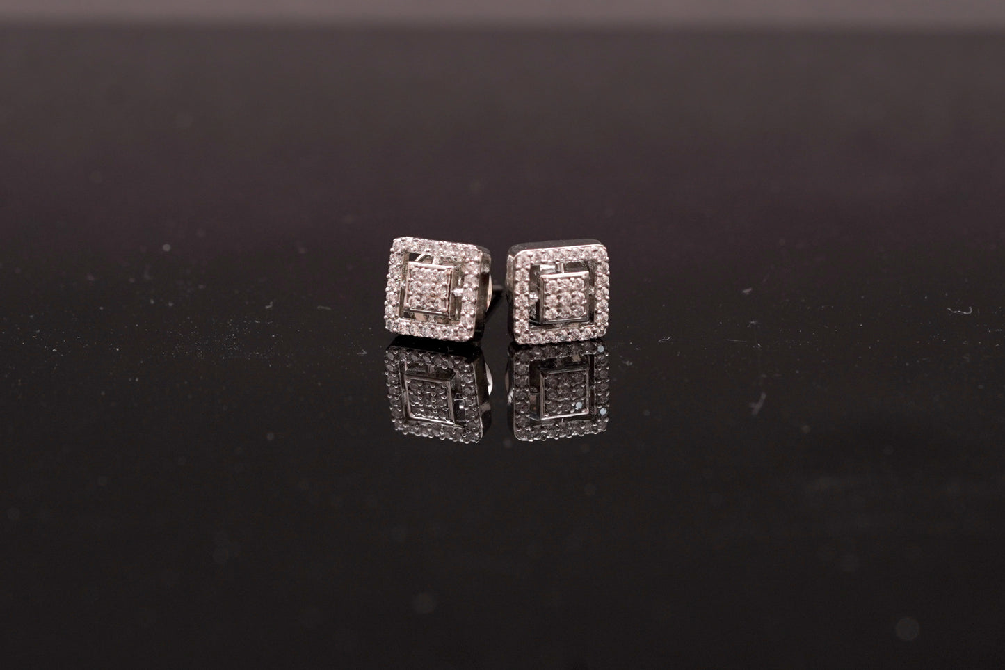 Elegant American diamond studs in a square shape in white gold finish