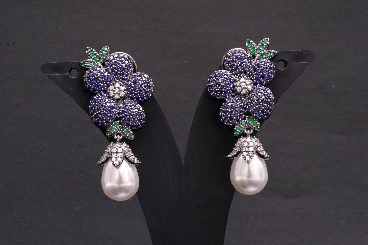 Exquisite flower shaped earrings with a pearl drop