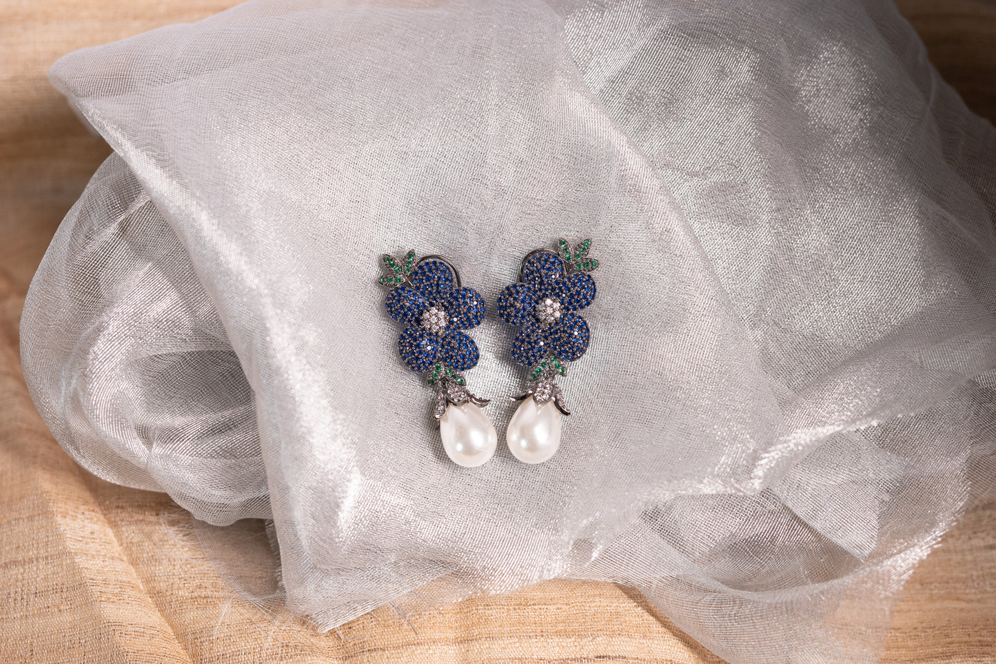 Exquisite flower shaped earrings with a pearl drop