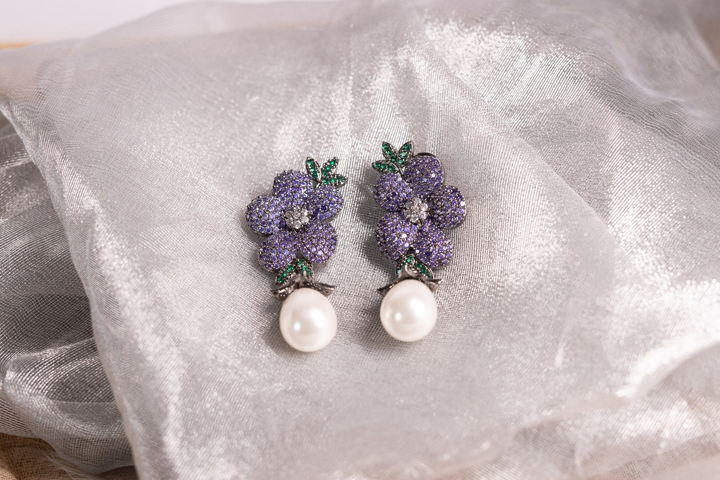 Exquisite flower shaped earrings with a pearl drop