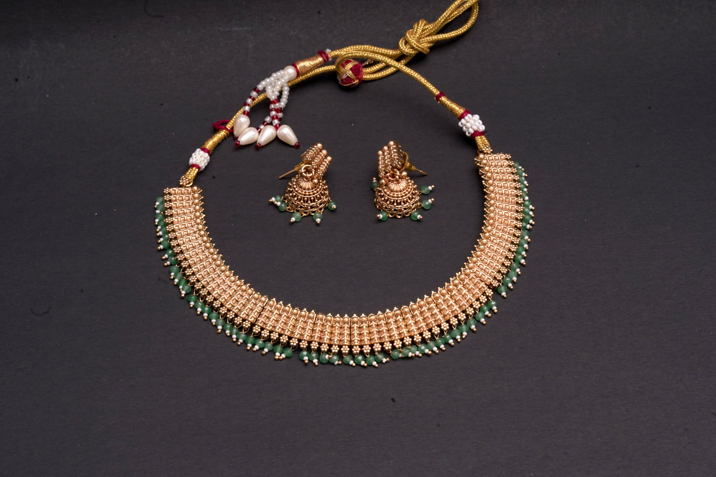 Interlink necklace with unique jhumkas in a gold finish
