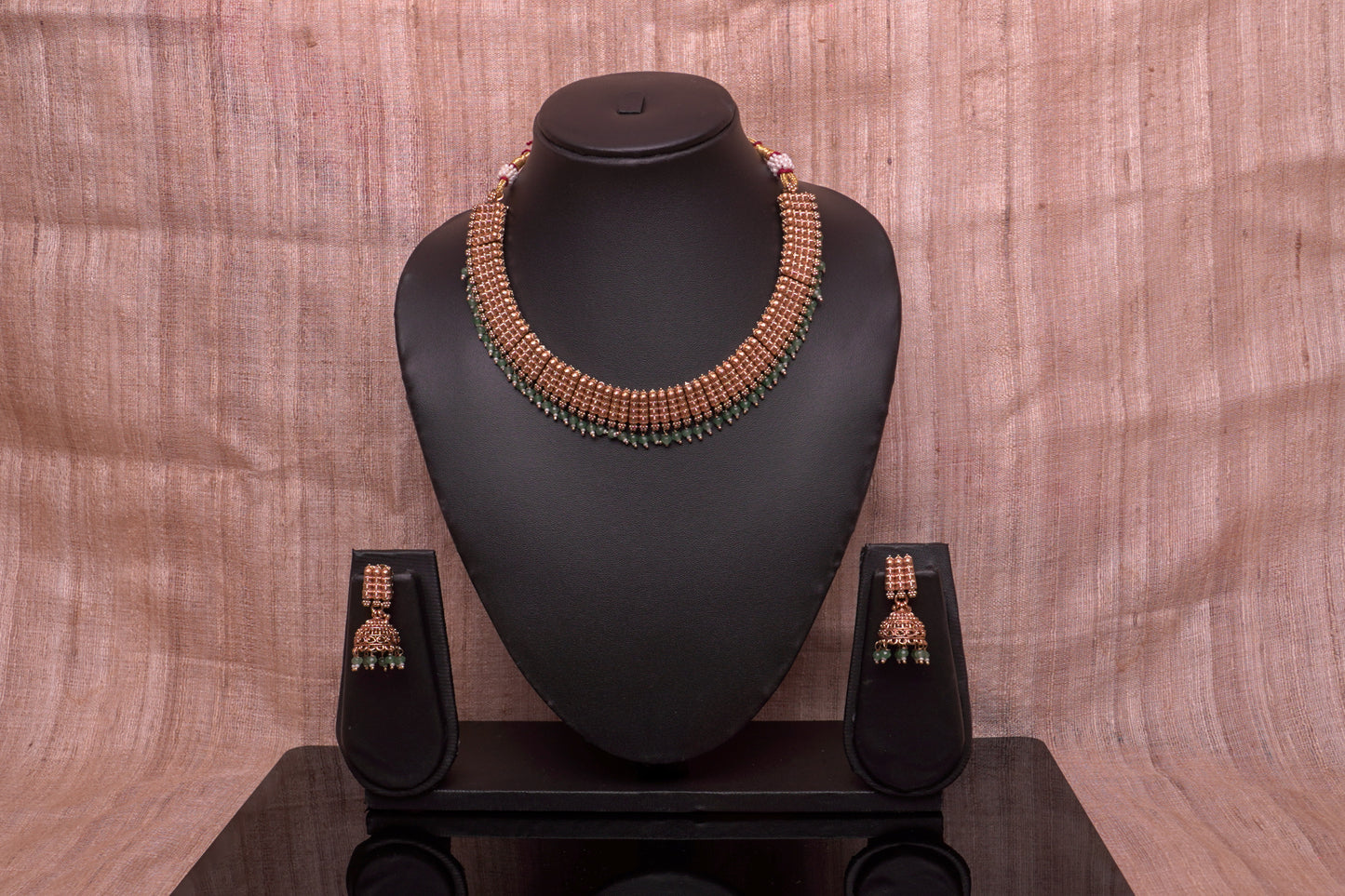 Interlink necklace with unique jhumkas in a gold finish