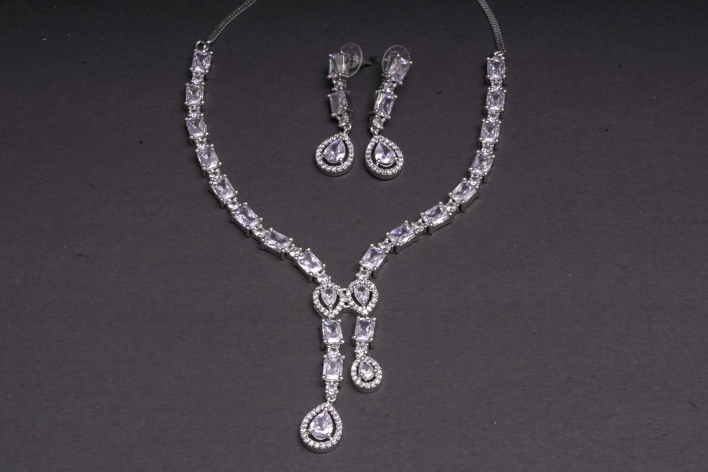 Irresistible necklace set with a double tear drop pendant in real American diamonds
