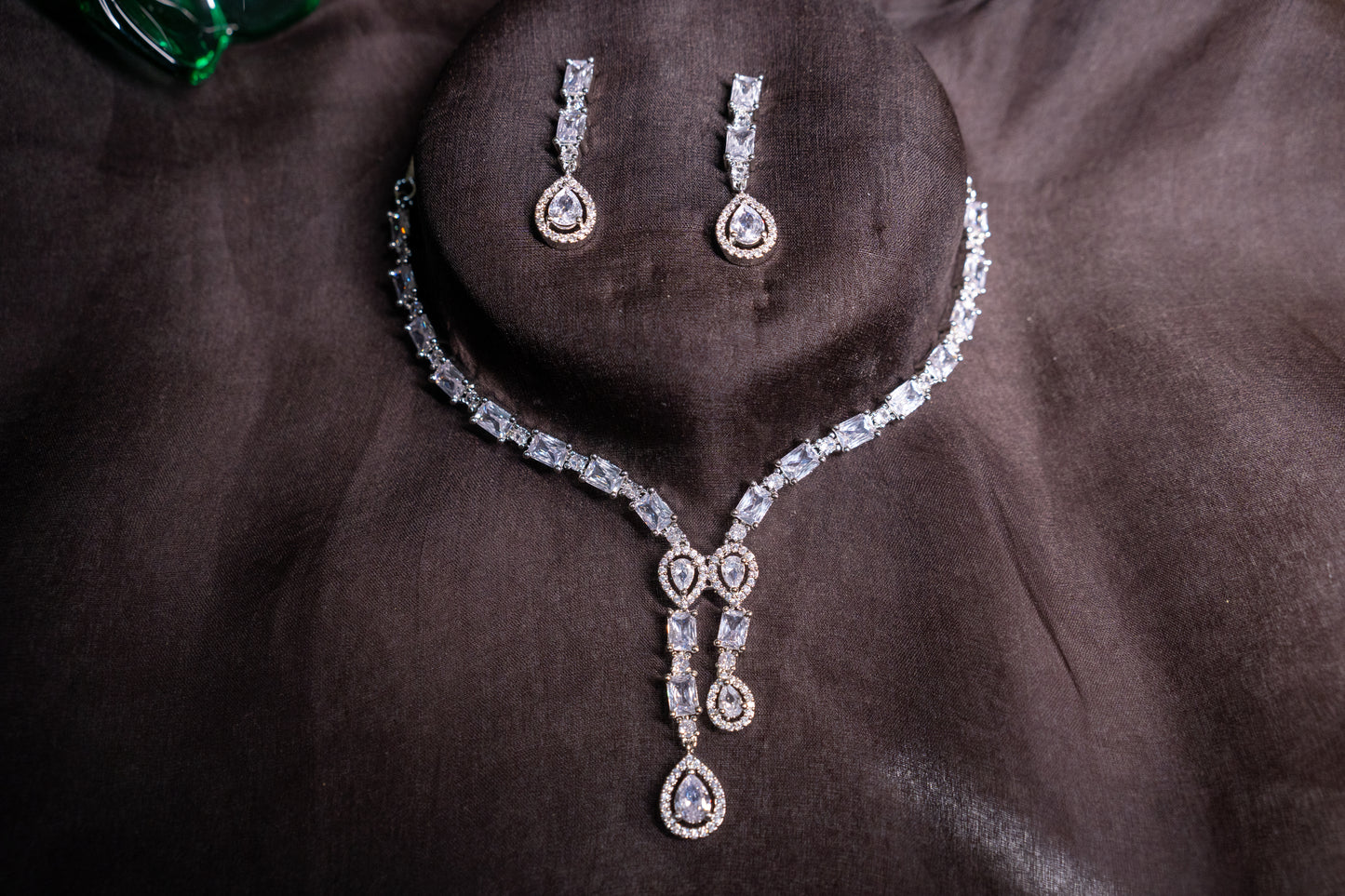 Irresistible necklace set with a double tear drop pendant in real American diamonds