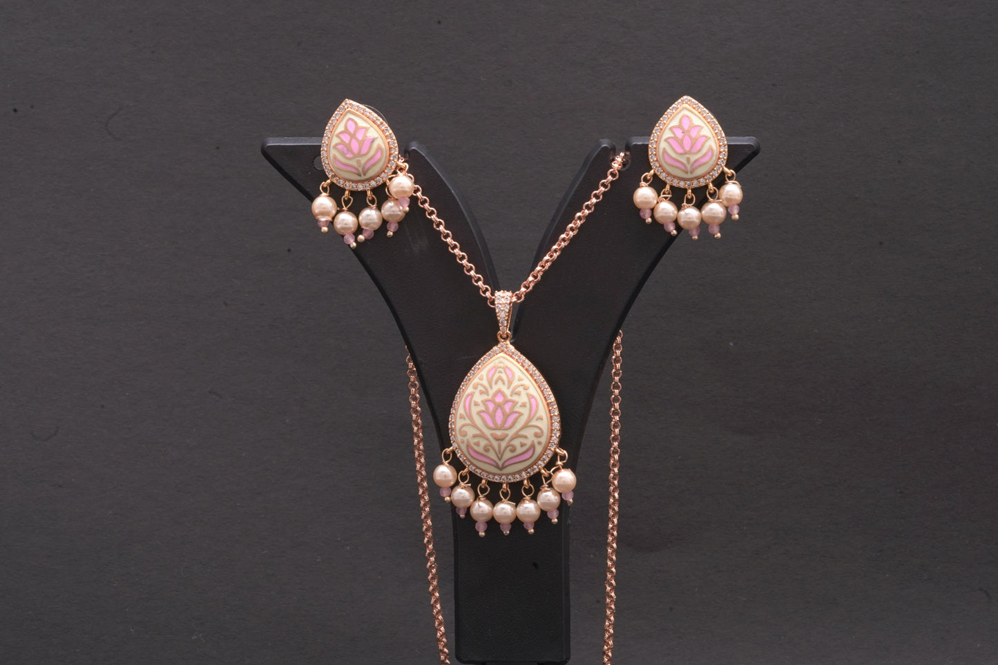 Pendant set in fine enamel work with stone polki and dainty pearls