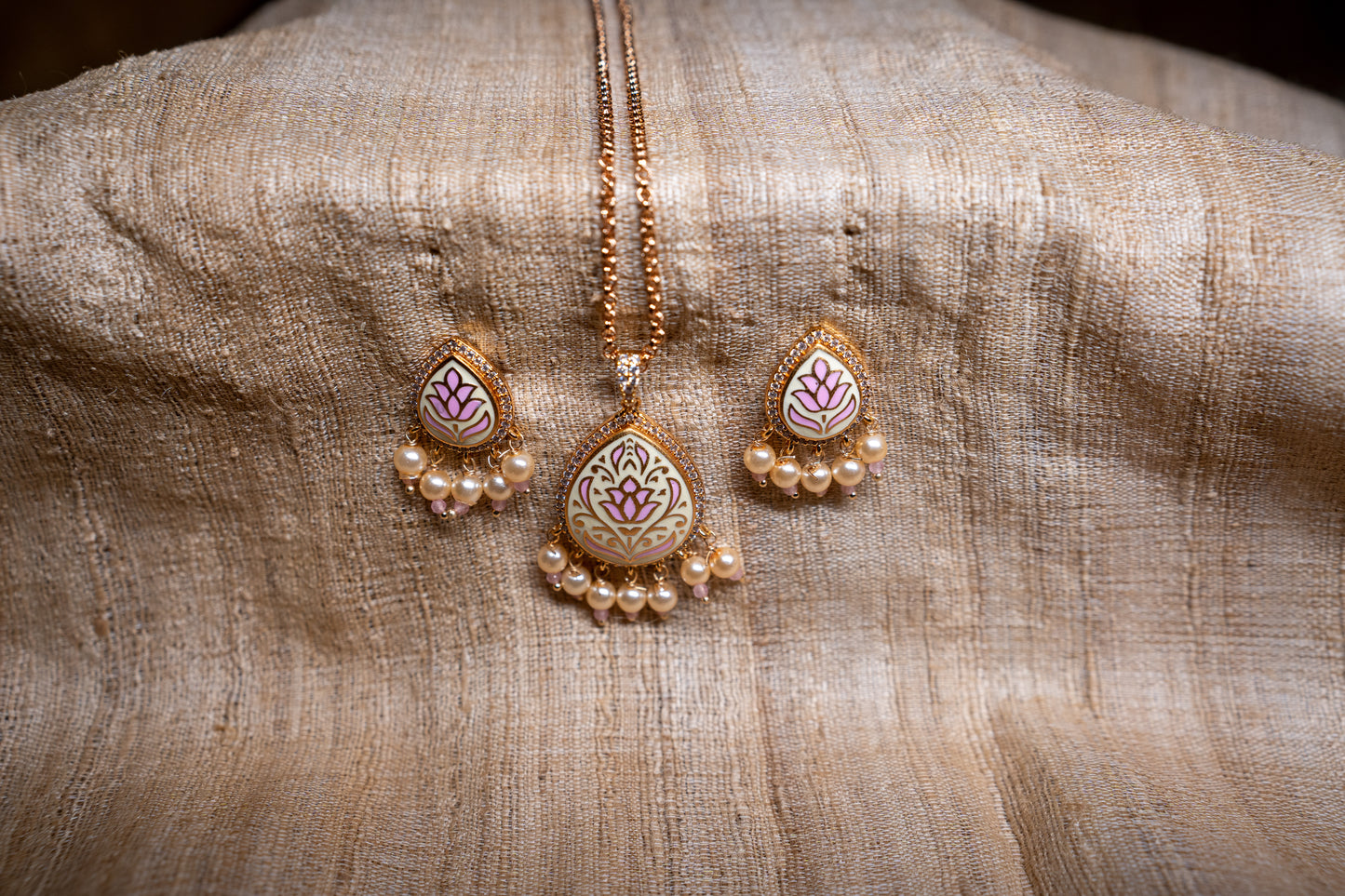 Pendant set in fine enamel work with stone polki and dainty pearls