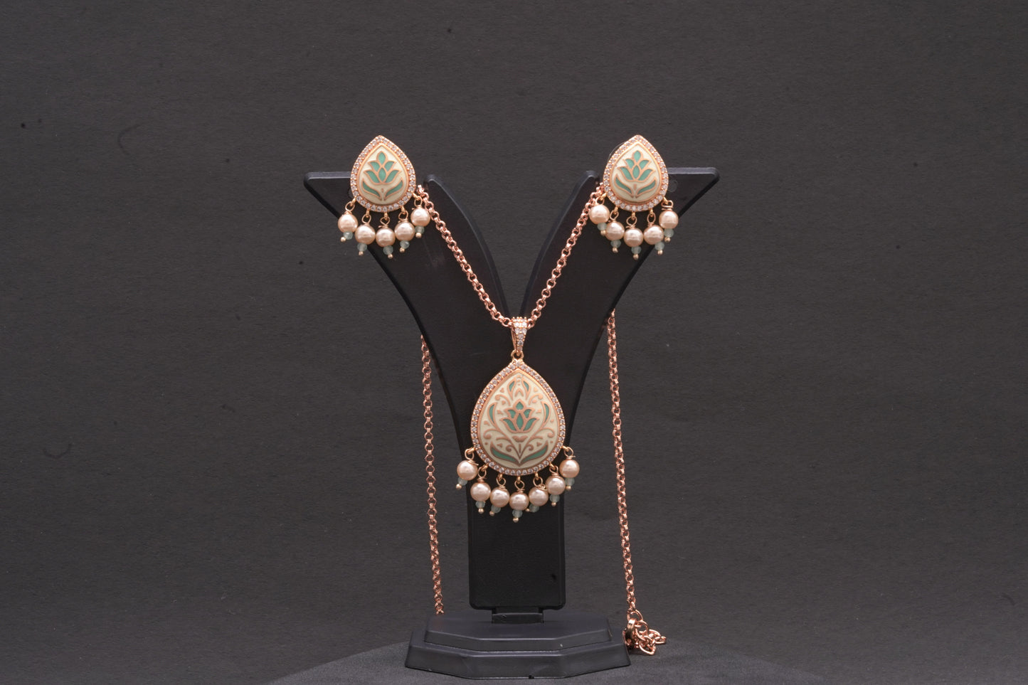 Pendant set in fine enamel work with stone polki and dainty pearls