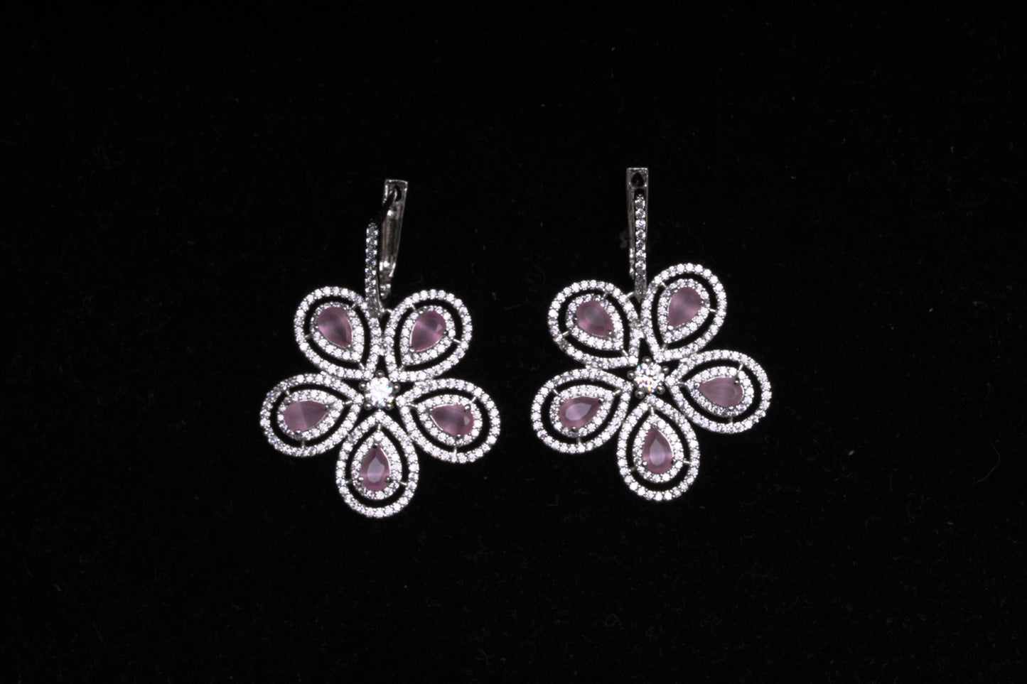 Pretty flower shaped American diamond earrings in feminine pink