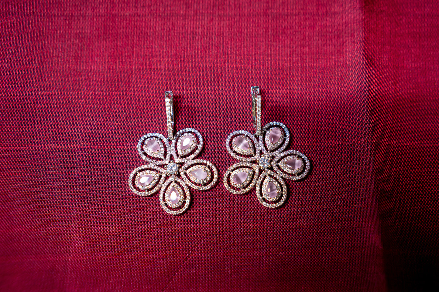 Pretty flower shaped American diamond earrings in feminine pink