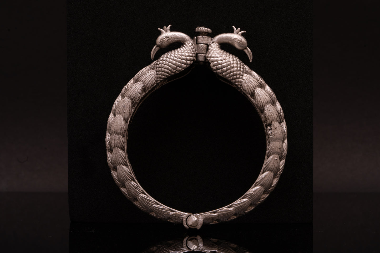 Peacock bracelet or kada with opulent carving in silver finish